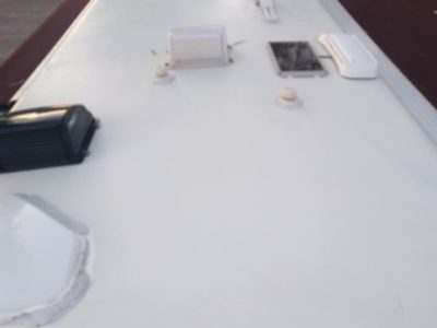 A white table with some papers on it