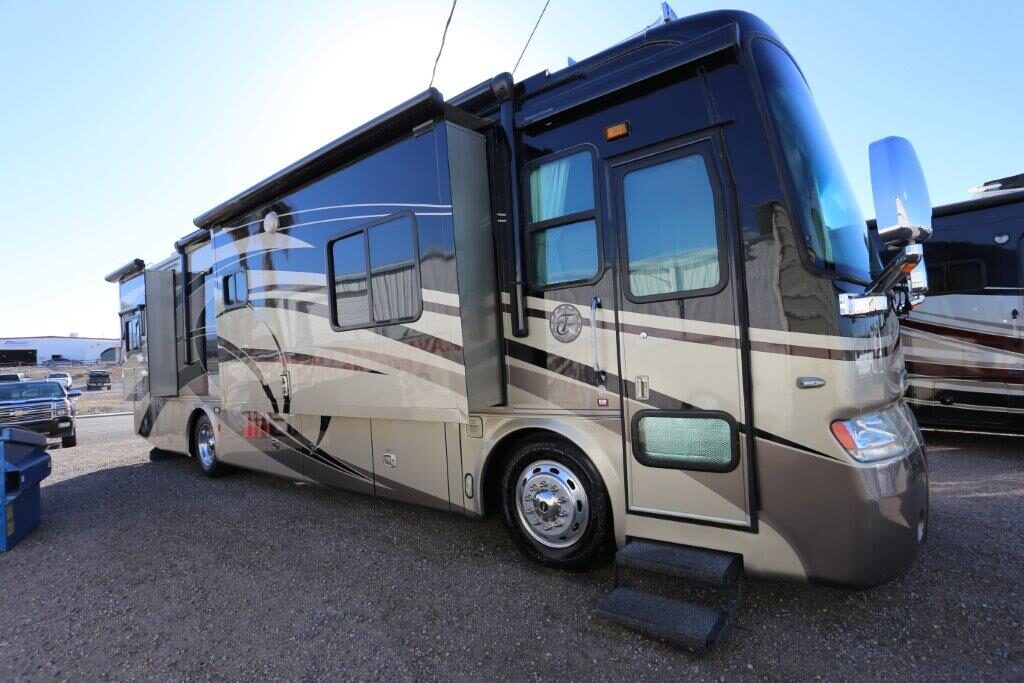 A large rv parked on the side of a road.