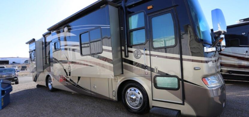 A large rv parked on the side of a road.