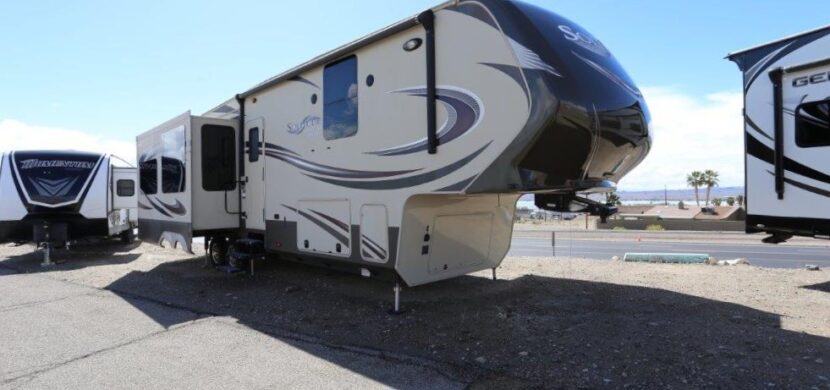 A large rv parked on the side of a road.