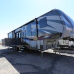 A large rv parked in the parking lot.