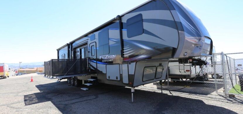 A large rv parked in the parking lot.